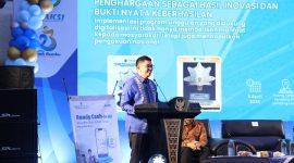 Bupati Tanah Bumbu, Andi Rudi Latif, menyampaikan sambutan saat High Level Meeting (HLM) TP2DD 2026 di Mini Stage EXPO Tanbu, Simpang Empat, Minggu (05/04/2026)